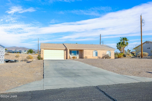 ranch-style home with a garage