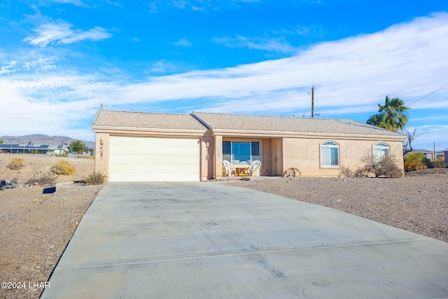 ranch-style home with a garage