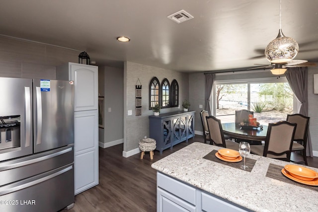 881 Bryce Ct, Lake Havasu City, AZ 86406 - kitchen with stainless steel fridge with ice dispenser, baseboards, ceiling fan, dark wood-type flooring, and light stone counters