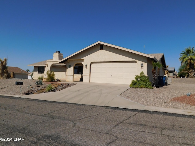 single story home with a garage