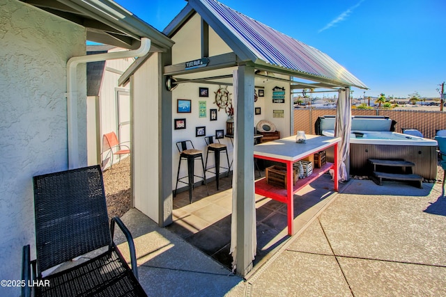 610 Roamer Ln, Lake Havasu City, AZ 86403 - view of patio / terrace with fence, outdoor dry bar, and a hot tub