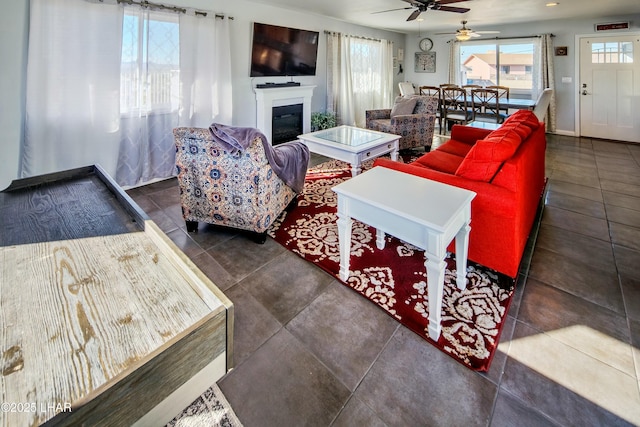 610 Roamer Ln, Lake Havasu City, AZ 86403 - living area with ceiling fan, baseboards, and a glass covered fireplace