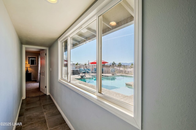 610 Roamer Ln, Lake Havasu City, AZ 86403 - hallway featuring dark tile patterned floors and baseboards