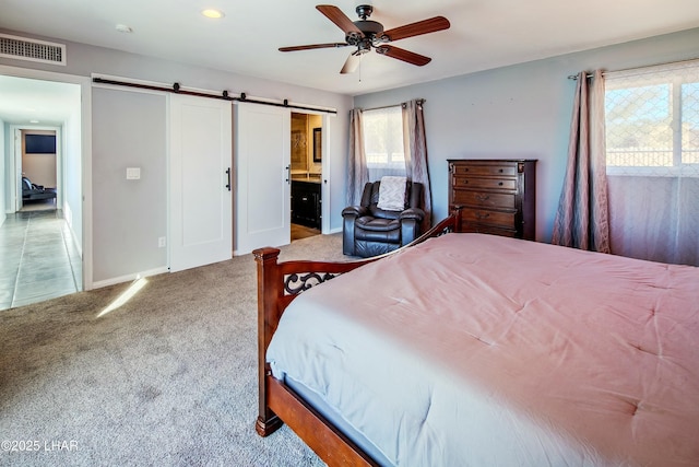 610 Roamer Ln, Lake Havasu City, AZ 86403 - bedroom with visible vents, ceiling fan, a barn door, carpet flooring, and ensuite bath