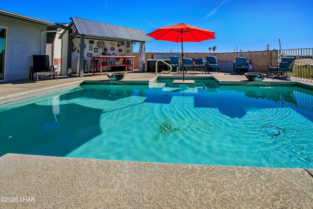 view of pool featuring fence, a patio area, and a fenced in pool