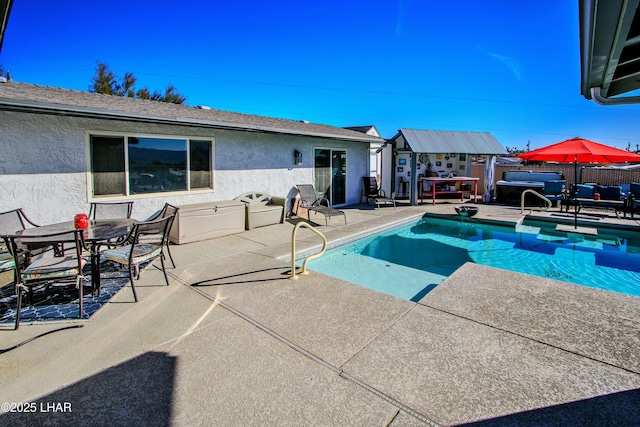 610 Roamer Ln, Lake Havasu City, AZ 86403 - view of swimming pool with a fenced in pool, fence, an outbuilding, and a patio area