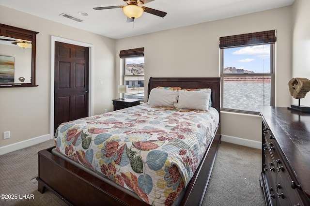 8652 Hopi Dr, Parker, AZ 85344 - carpeted bedroom featuring baseboards and a ceiling fan