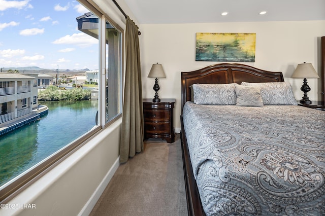 8652 Hopi Dr, Parker, AZ 85344 - bedroom featuring access to outside, carpet floors, recessed lighting, and a water view