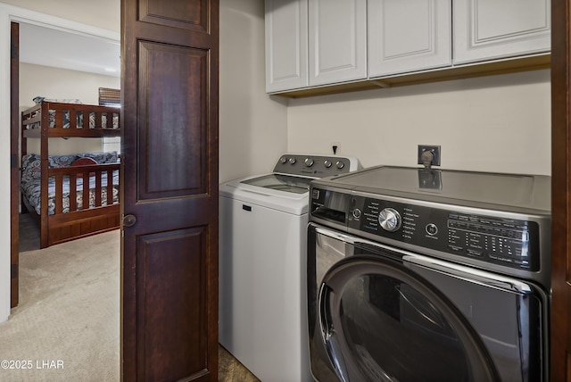 8652 Hopi Dr, Parker, AZ 85344 - washroom featuring washing machine and clothes dryer, cabinet space, and carpet floors