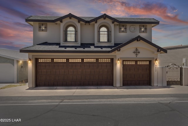 8652 Hopi Dr, Parker, AZ 85344 - mediterranean / spanish home featuring an attached garage and stucco siding