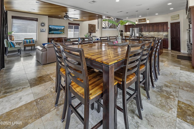 8652 Hopi Dr, Parker, AZ 85344 - dining area with recessed lighting, stone tile floors, and a ceiling fan
