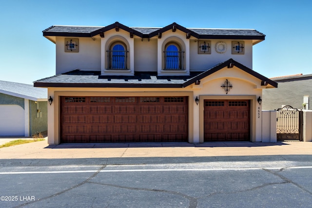 8652 Hopi Dr, Parker, AZ 85344 - mediterranean / spanish-style house featuring a garage and stucco siding