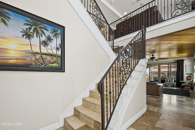 8652 Hopi Dr, Parker, AZ 85344 - stairs with ceiling fan, a towering ceiling, and recessed lighting