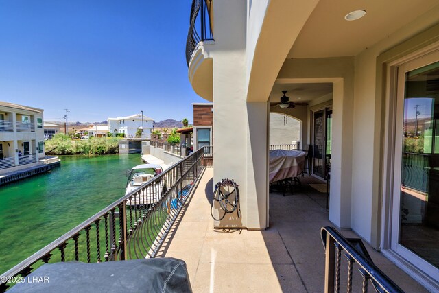 8652 Hopi Dr, Parker, AZ 85344 - balcony with a ceiling fan, a water view, and a residential view