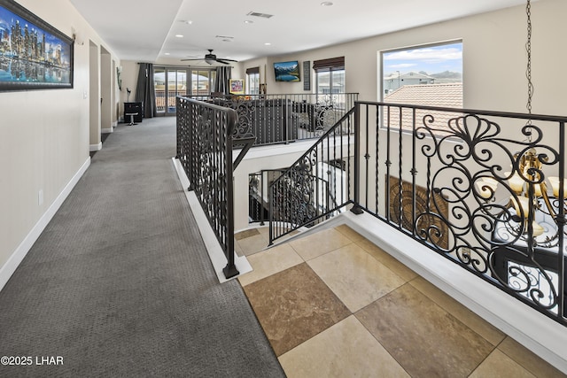 8652 Hopi Dr, Parker, AZ 85344 - stairs featuring a ceiling fan, carpet floors, and recessed lighting