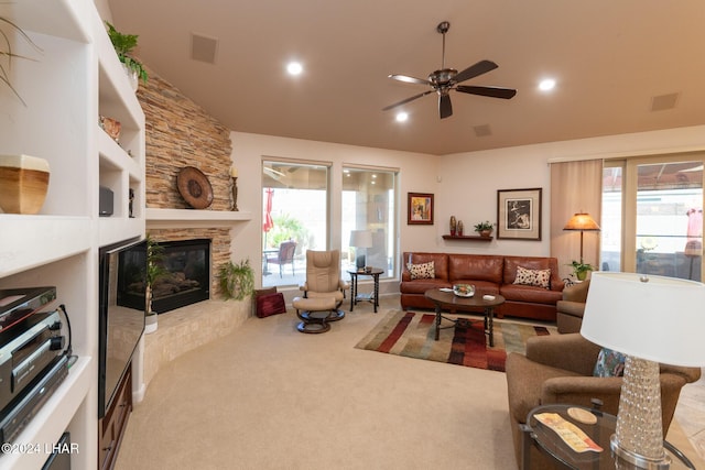 carpeted living area with recessed lighting, visible vents, a ceiling fan, and a stone fireplace