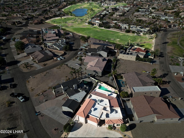 birds eye view of property featuring view of golf course and a residential view