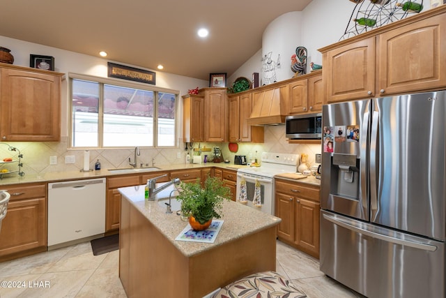 kitchen with light tile patterned floors, stainless steel appliances, decorative backsplash, a sink, and premium range hood