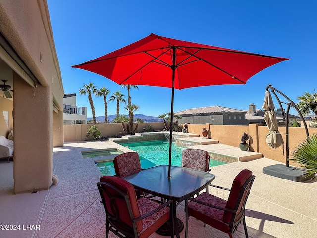 view of pool featuring a fenced in pool, outdoor dining space, a fenced backyard, and a patio