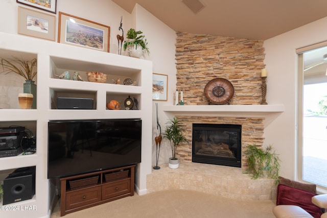 living room with a fireplace and carpet flooring