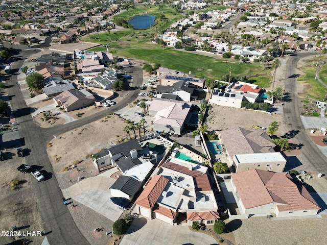 birds eye view of property featuring view of golf course and a residential view