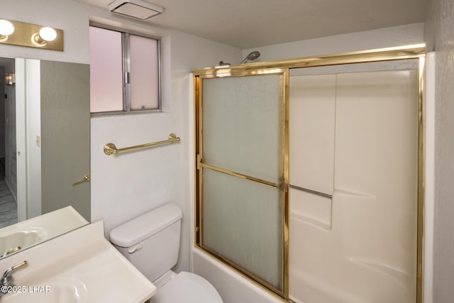 2301 Mcculloch Blvd N Unit E, Lake Havasu City, AZ 86403 - bathroom featuring toilet, combined bath / shower with glass door, and vanity