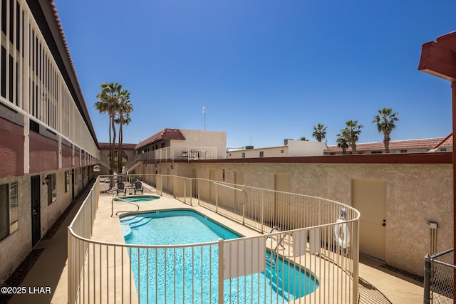 2301 Mcculloch Blvd N Unit E, Lake Havasu City, AZ 86403 - community pool featuring a patio area and fence