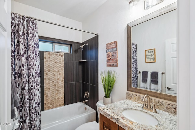 full bathroom with vanity, shower / tub combo, and toilet