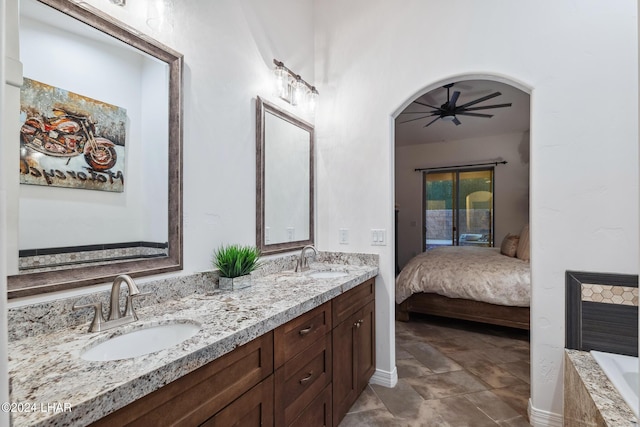 bathroom with ceiling fan and vanity