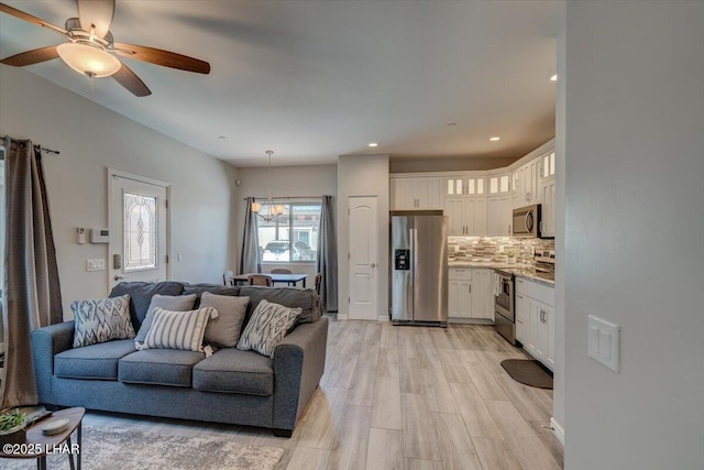 2950 N Kiowa Blvd Unit A101, Lake Havasu City, AZ 86404 - living room with light wood-style floors, a ceiling fan, and recessed lighting