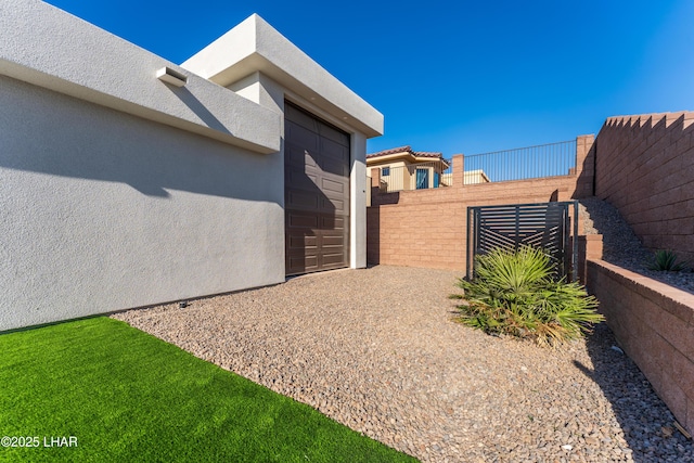 view of side of home with a garage