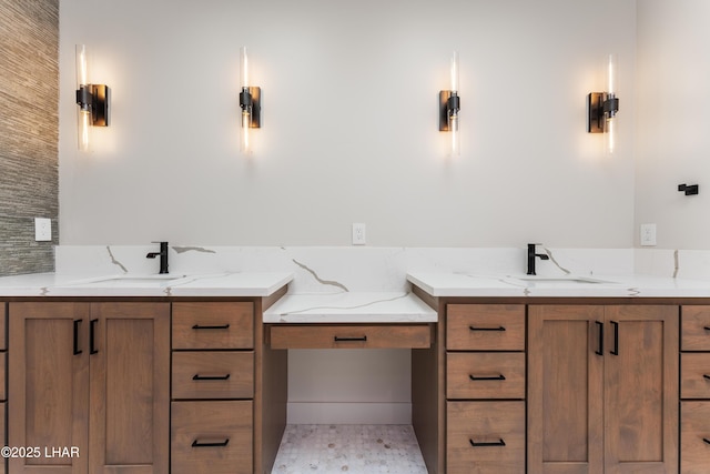 bathroom featuring vanity and backsplash