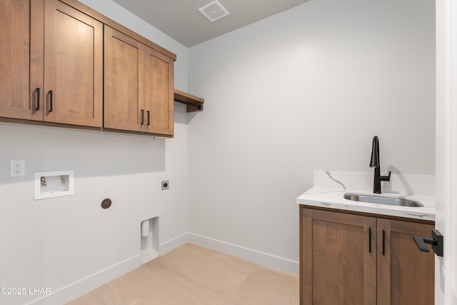 laundry area featuring cabinets, hookup for a washing machine, sink, and electric dryer hookup