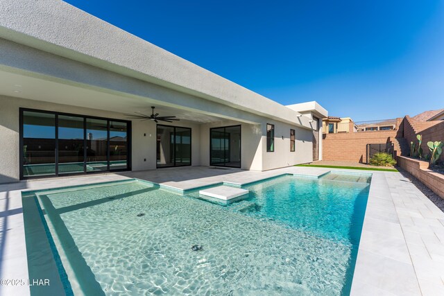 view of pool featuring an in ground hot tub, ceiling fan, and a patio area