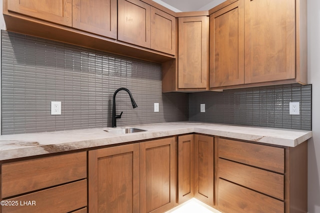 kitchen featuring sink and backsplash