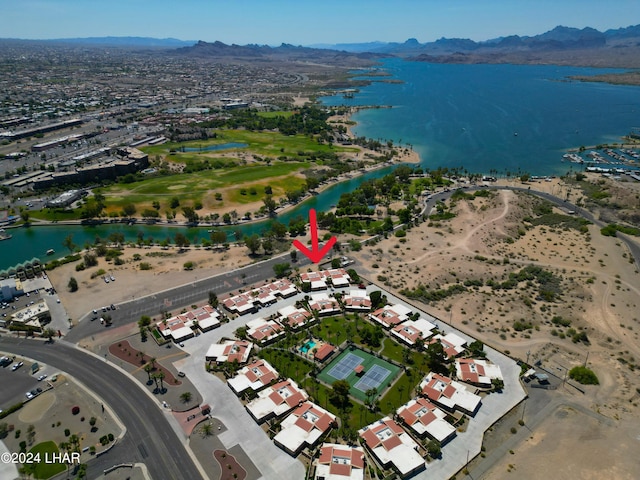 drone / aerial view featuring a water and mountain view