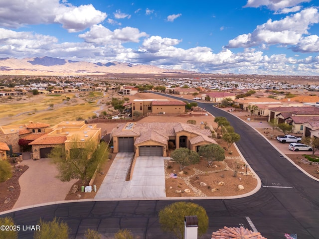 aerial view featuring a mountain view and a residential view