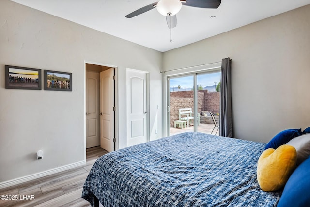 2950 N Kiowa Blvd Unit B102, Lake Havasu City, AZ 86404 - bedroom with access to outside, light wood finished floors, baseboards, and a ceiling fan