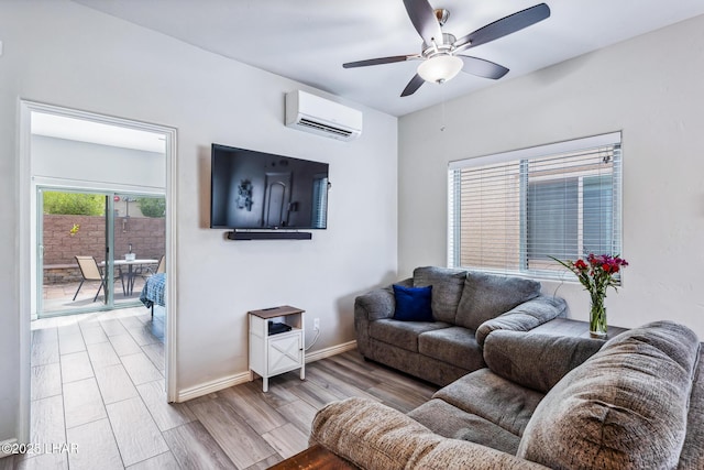 2950 N Kiowa Blvd Unit B102, Lake Havasu City, AZ 86404 - living room featuring a wall mounted AC, ceiling fan, wood finished floors, and baseboards