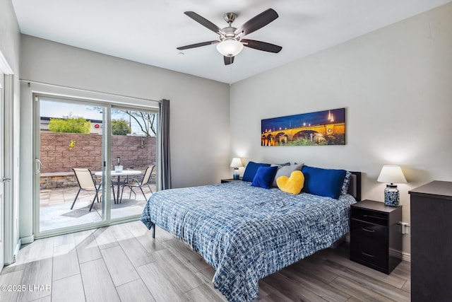 2950 N Kiowa Blvd Unit B102, Lake Havasu City, AZ 86404 - bedroom with access to outside, wood finished floors, ceiling fan, and baseboards