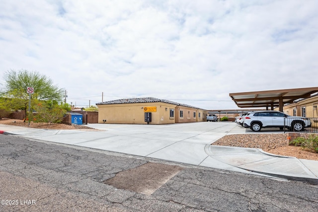 2950 N Kiowa Blvd Unit B102, Lake Havasu City, AZ 86404 - view of front of property with stucco siding, a tiled roof, and fence