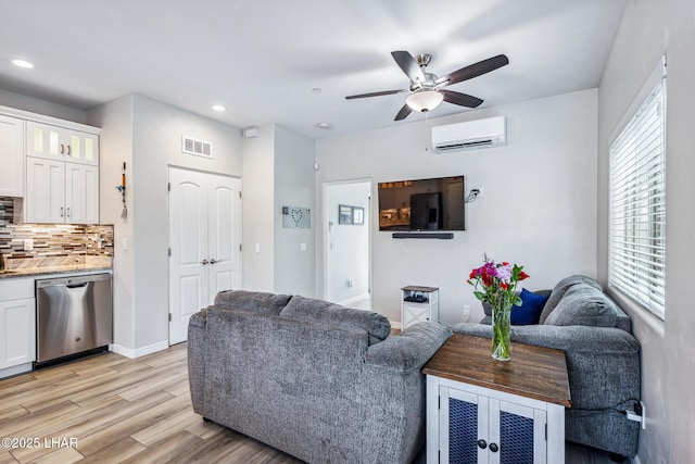 2950 N Kiowa Blvd Unit B102, Lake Havasu City, AZ 86404 - living room featuring an AC wall unit, recessed lighting, ceiling fan, light wood-style floors, and baseboards