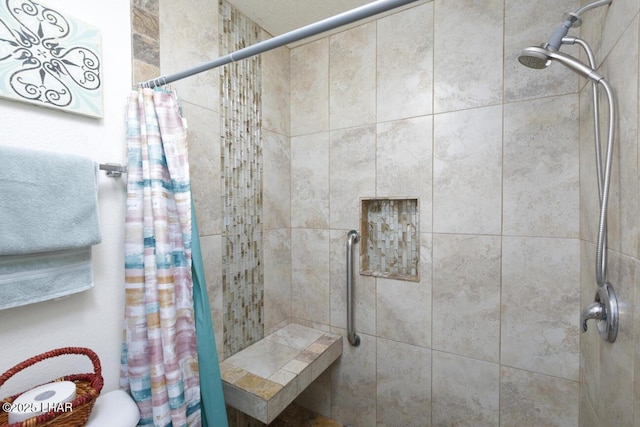 bathroom featuring a shower with curtain