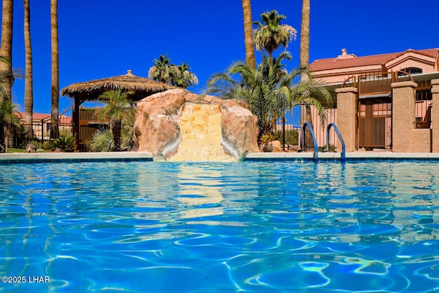 view of swimming pool featuring a gazebo