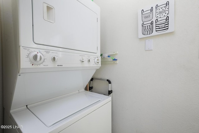 laundry room with stacked washer / drying machine