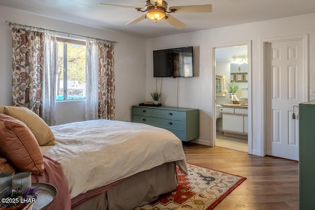 bedroom featuring ceiling fan, wood finished floors, and connected bathroom