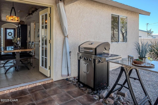 view of patio featuring a grill