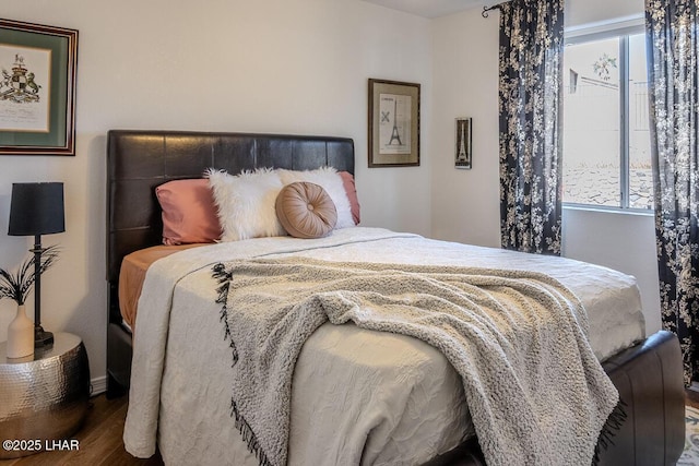 bedroom featuring wood finished floors