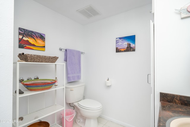 565 Jones Dr Unit 3B, Lake Havasu City, AZ 86406 - bathroom with vanity, toilet, tile patterned floors, and baseboards
