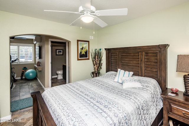 2641 Palo Verde Blvd N, Lake Havasu City, AZ 86404 - bedroom featuring ceiling fan, arched walkways, baseboards, and ensuite bathroom